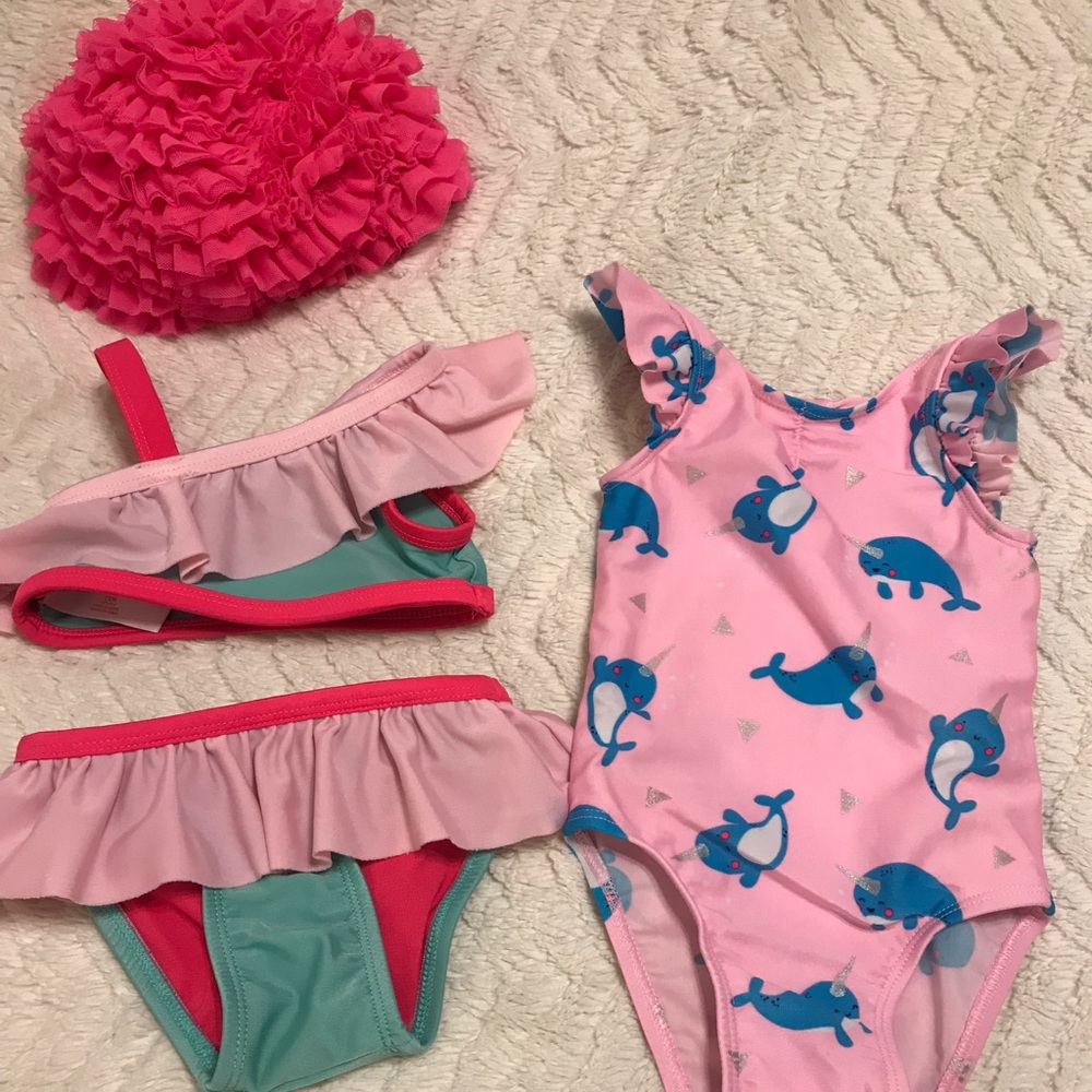 2 bathing suits and a bathing cap